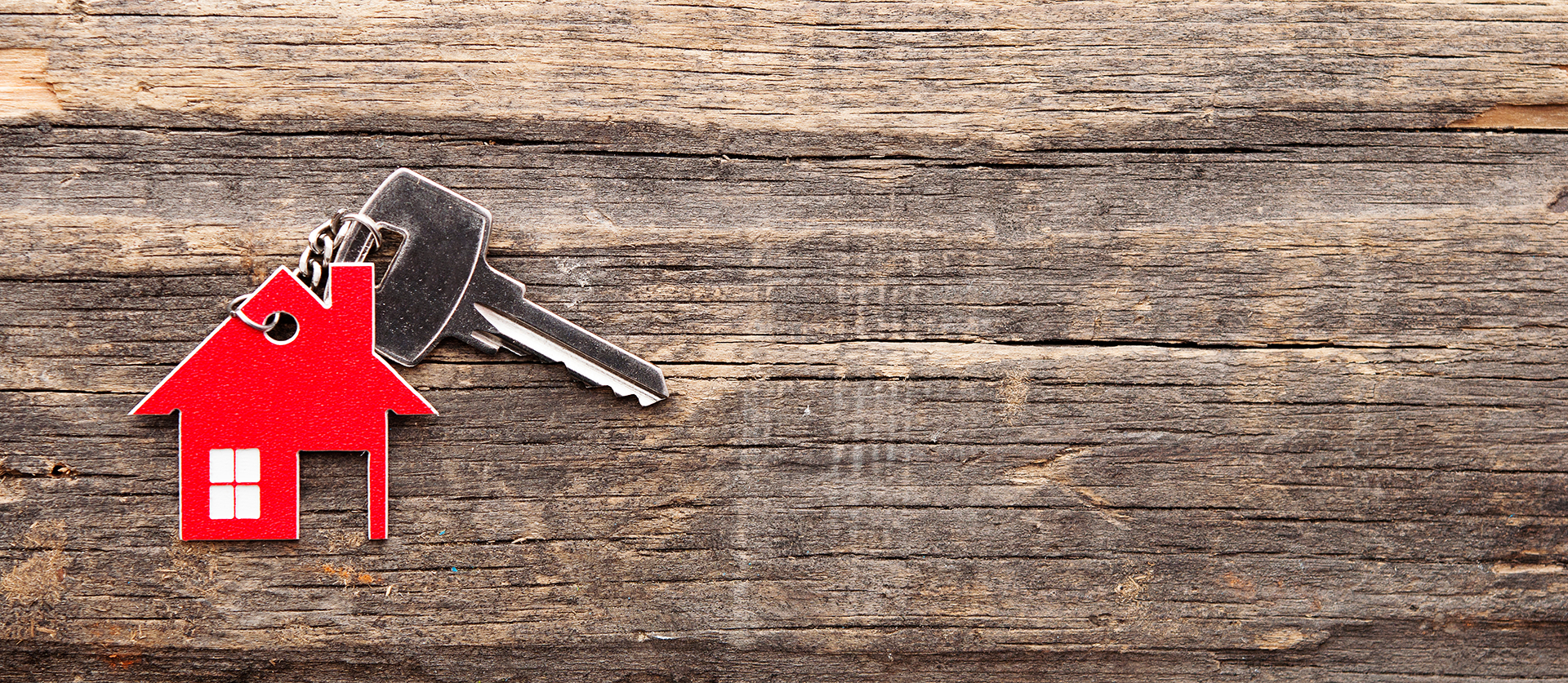 key attached to a house shaped key chain